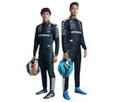 Two individuals in racing suits with Petronas and Adidas logos on a white background