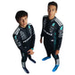 Two children wearing Formula 1-themed racing suits with visible branding on a white background.